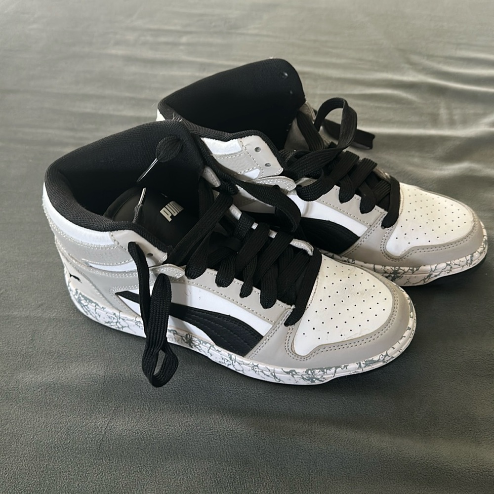 Kids Black, white and gray high top Puma sneakers